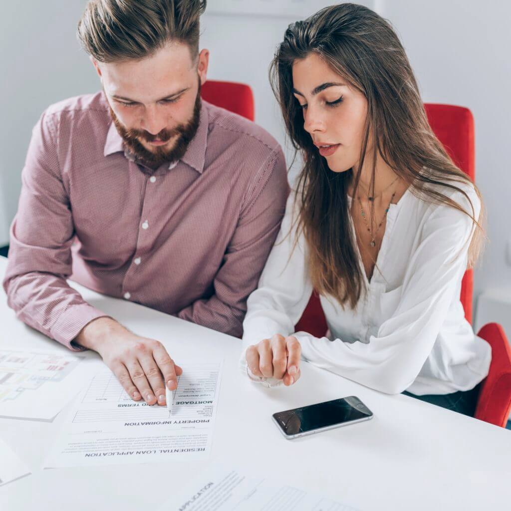 couple signing mortgage contract